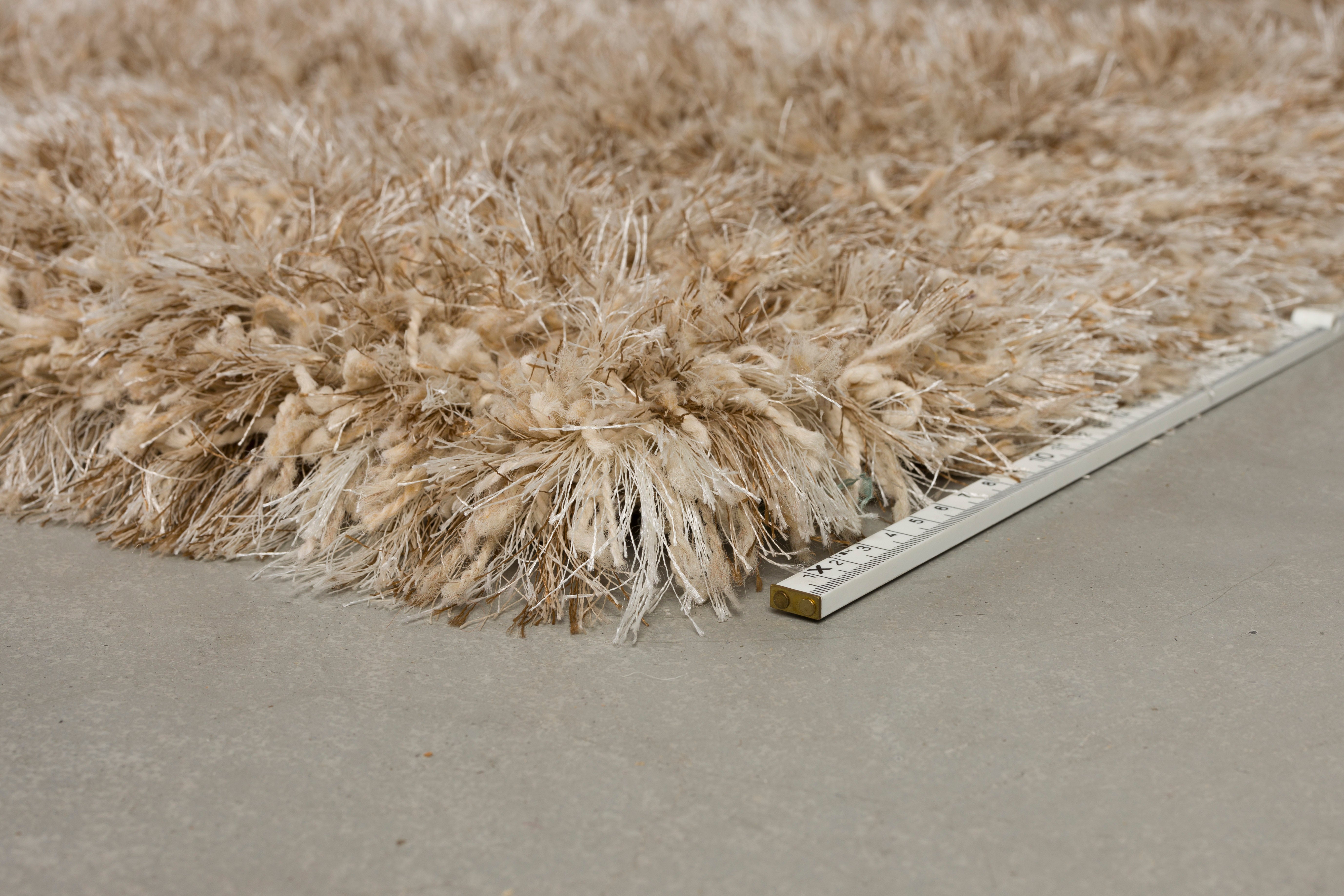 HAIRY dark beige rug with long pile