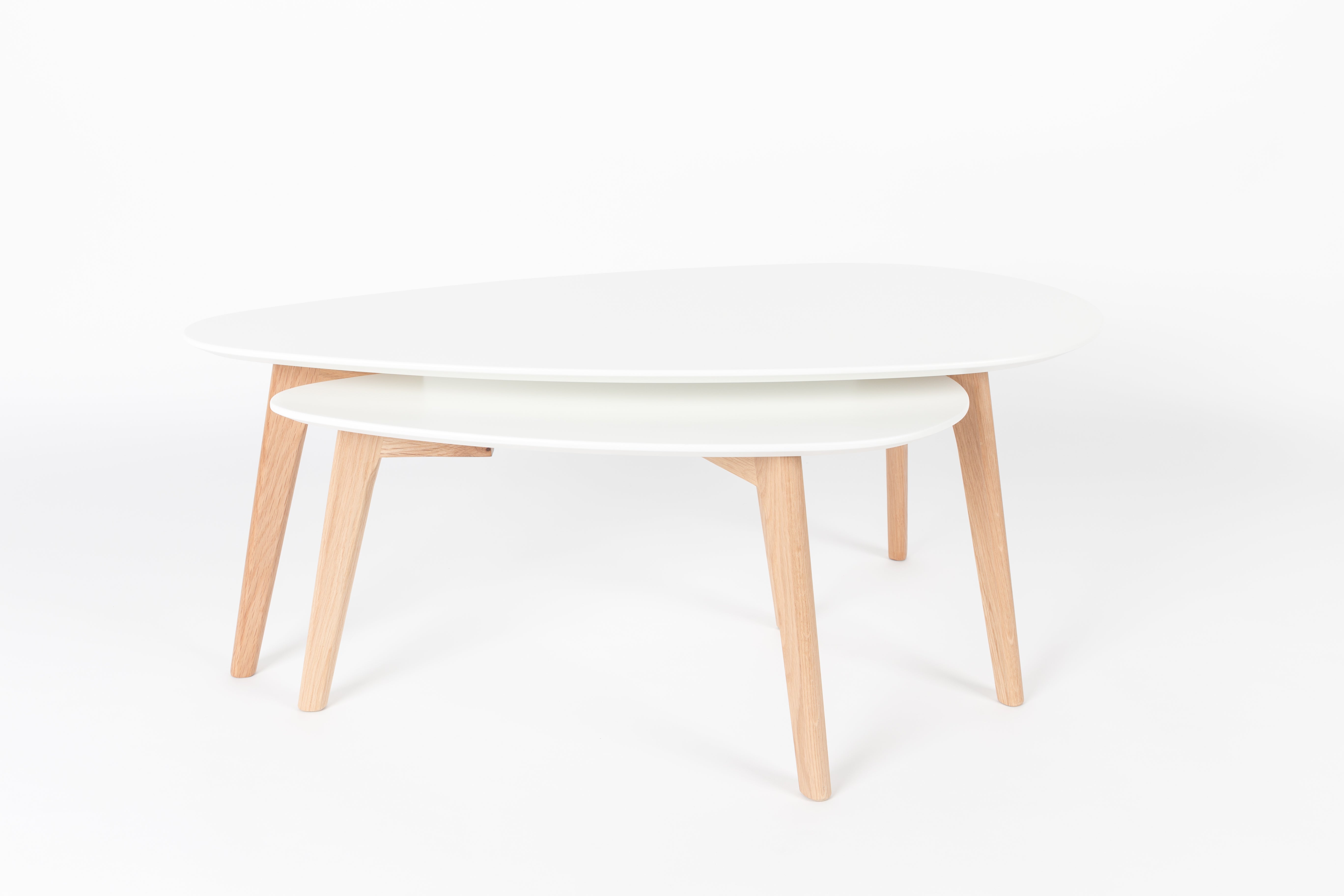 A set of white drop tables with a wooden base