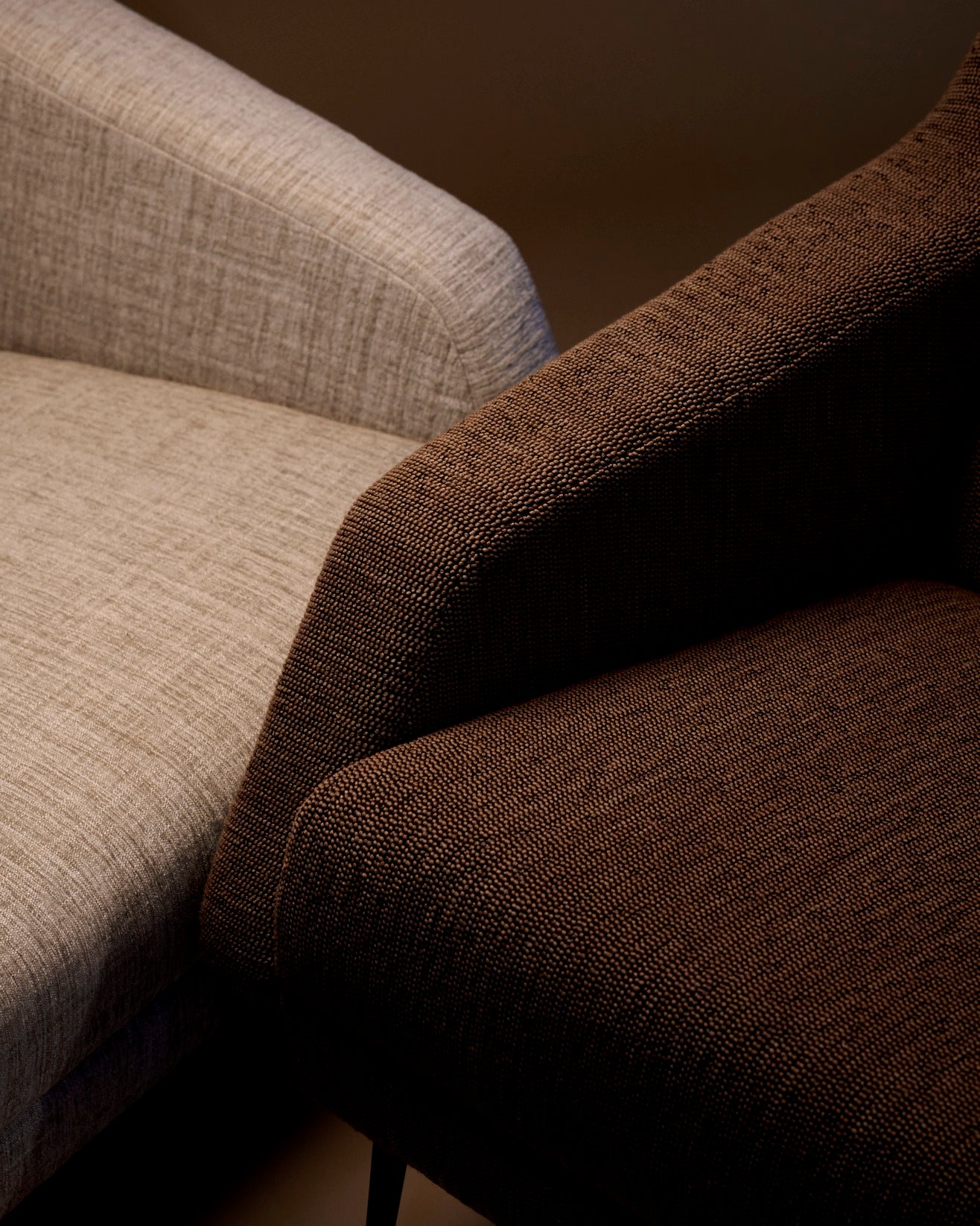 CDC.1 upholstered armchair with a black base