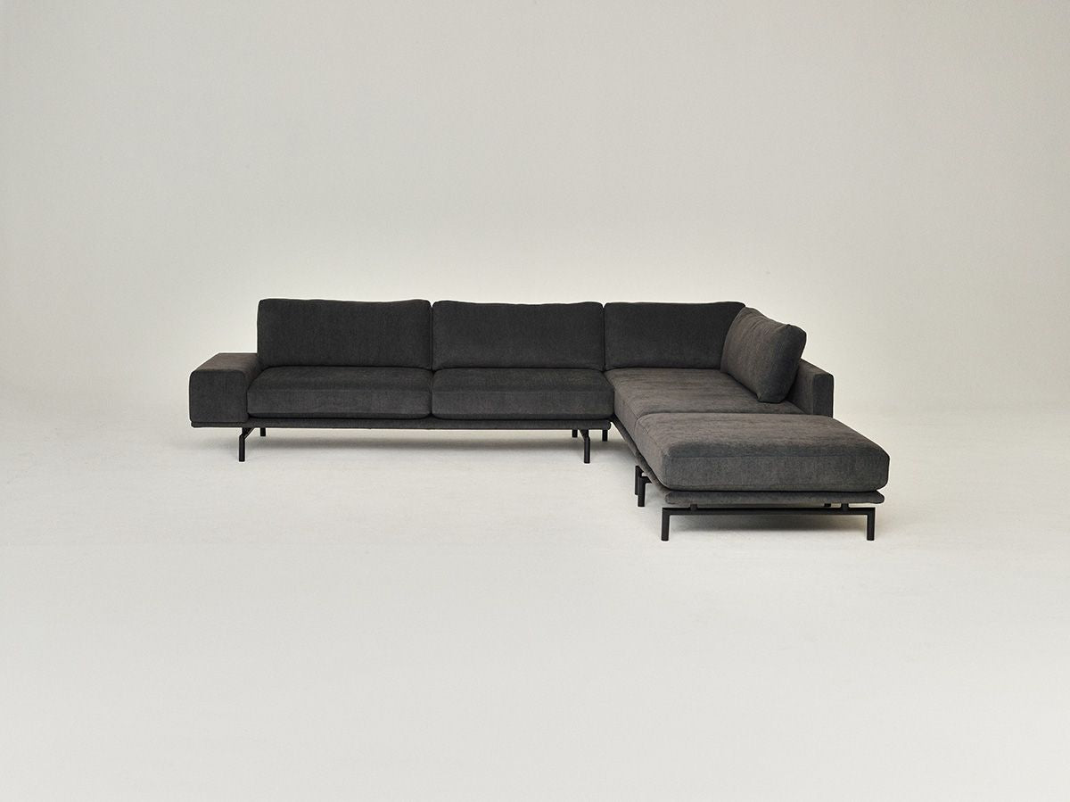 Left-facing 4-seater sofa BRIXTON upholstered with a black base