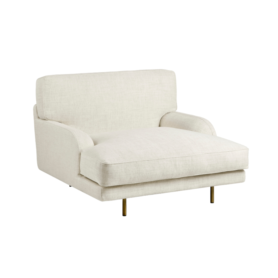 Upholstered FLANEUR armchair with a brass base