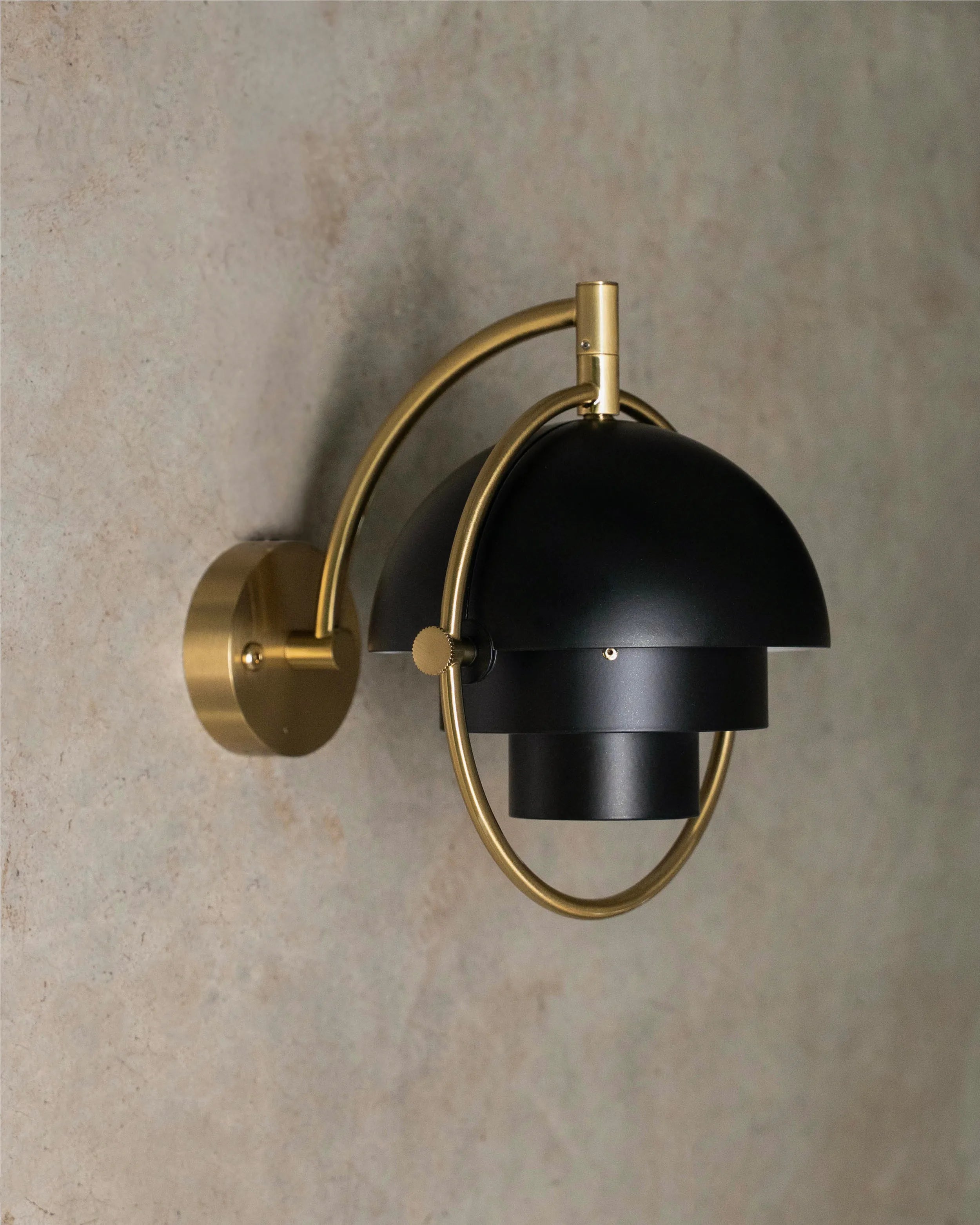 MULTI-LITE wall lamp in black with a brass base