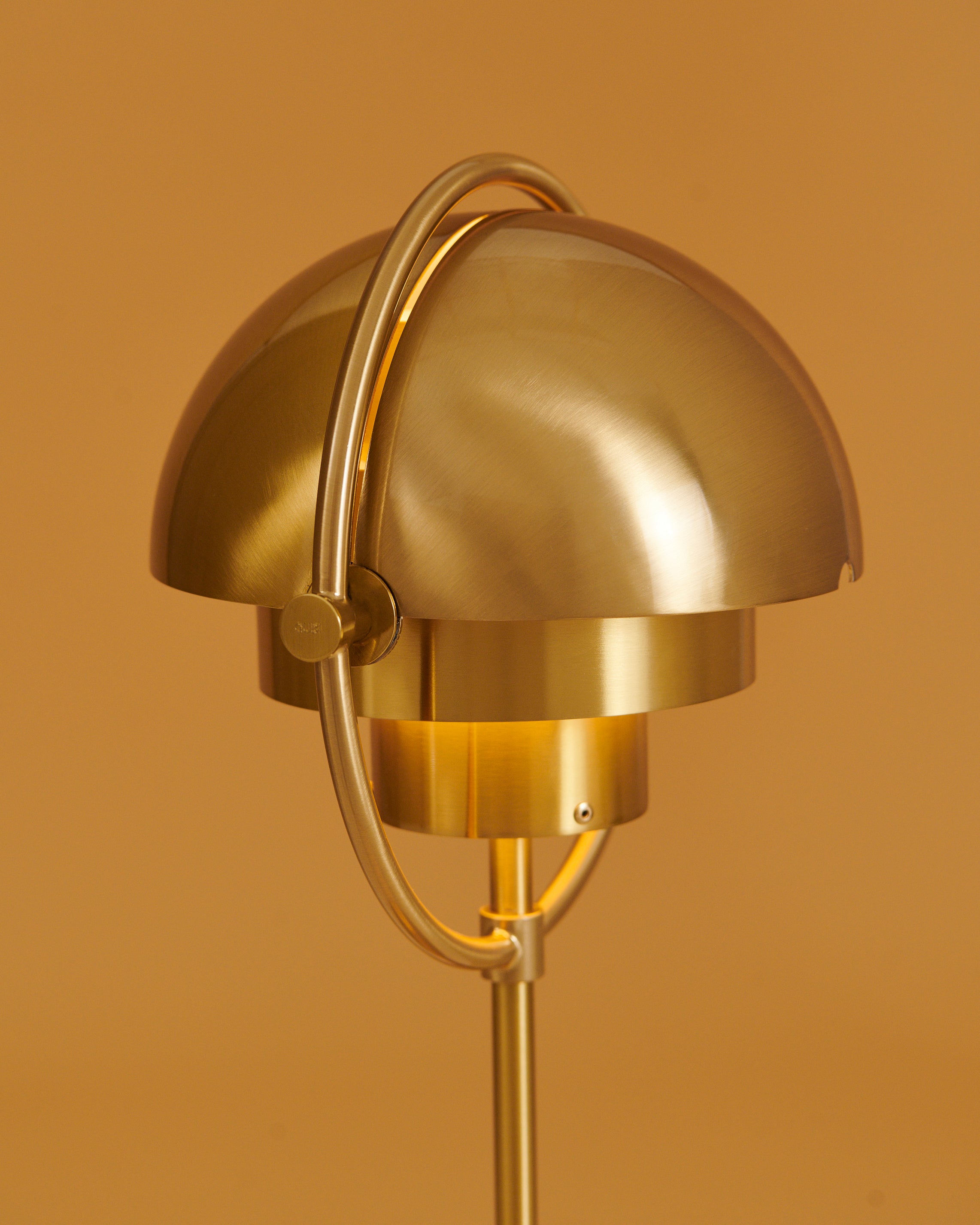 MULTI-LITE portable lamp in cream with a brass base