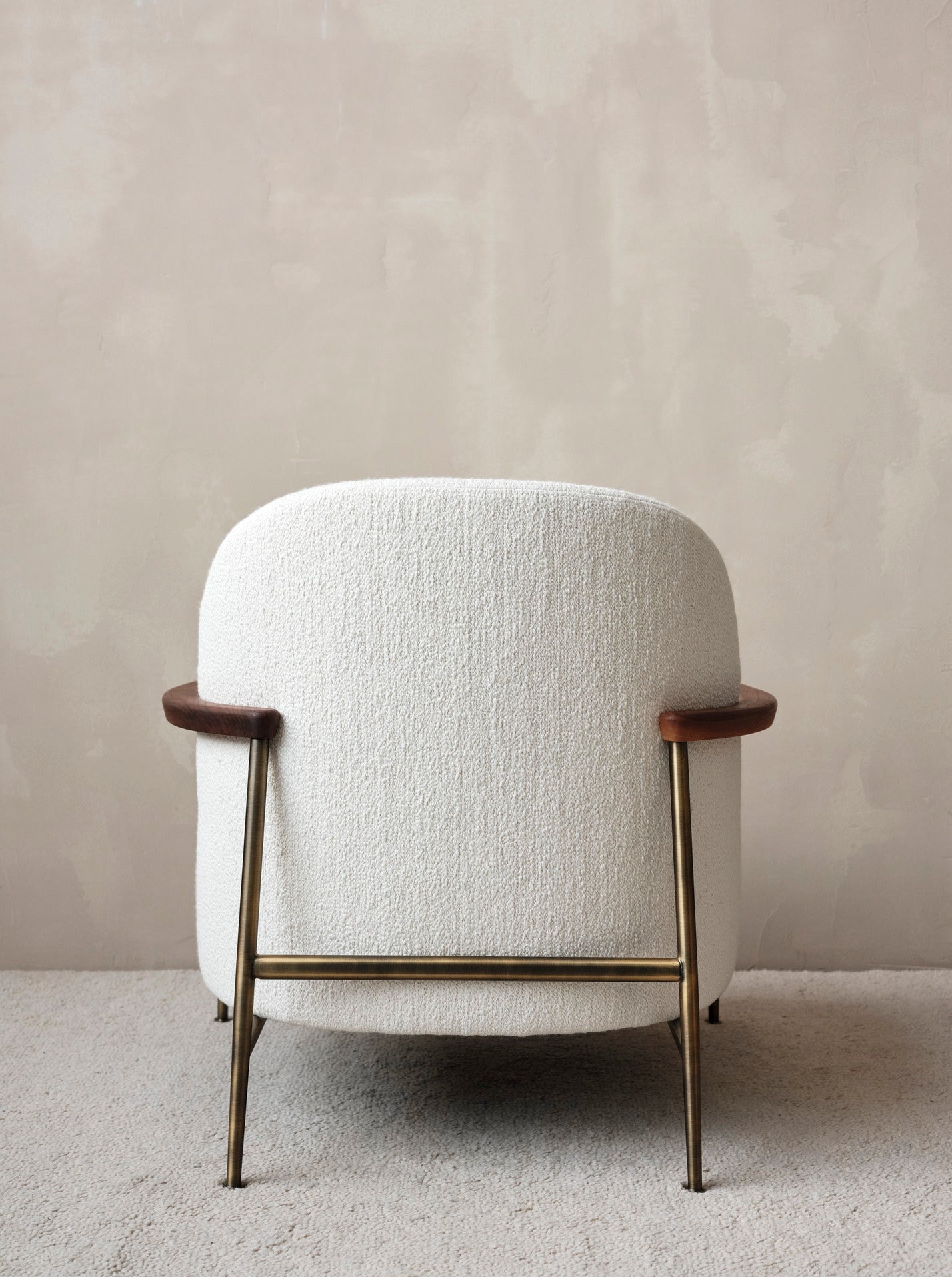 SEJOUR upholstered armchair with a brass base