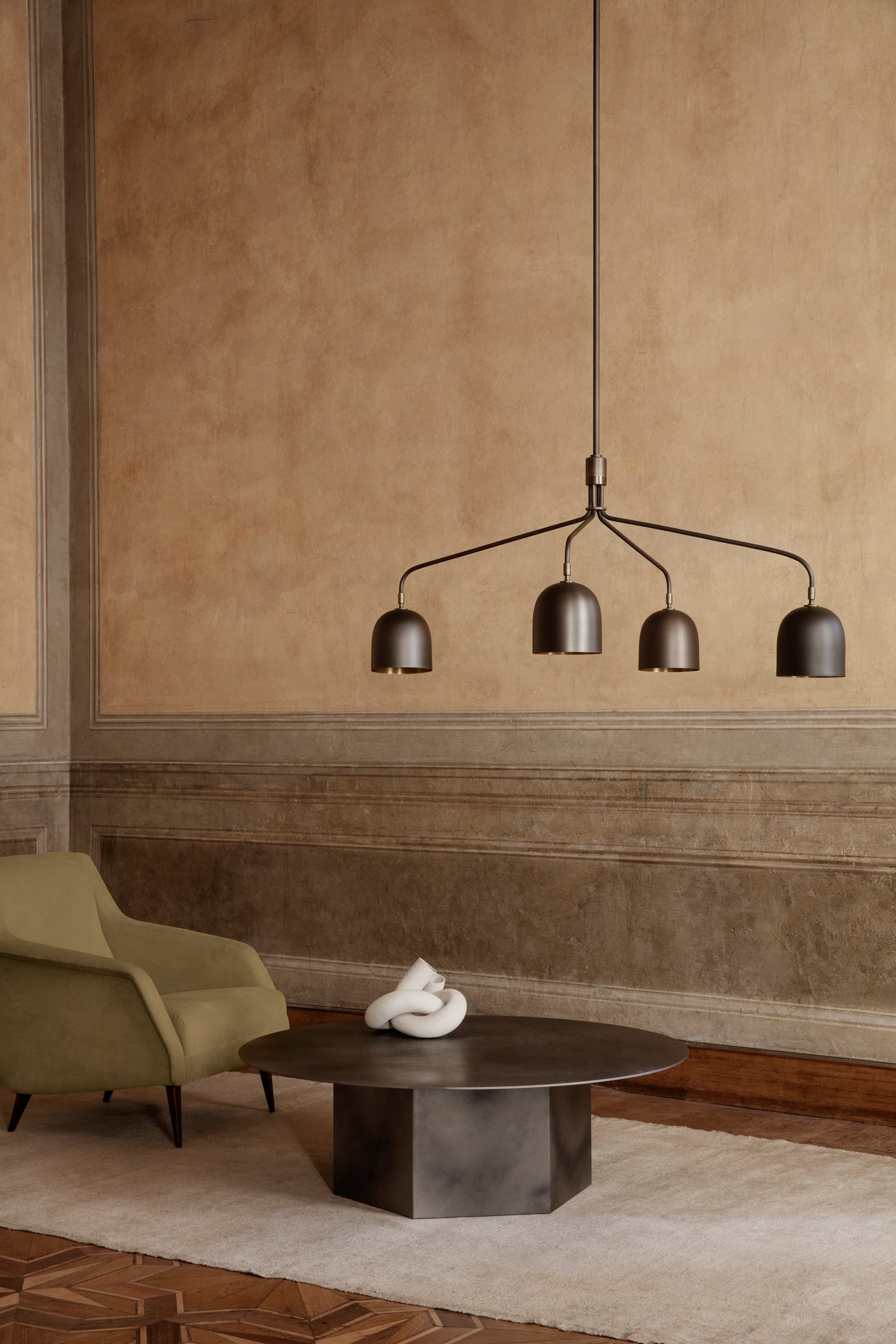 CDC.1 upholstered armchair with a black base