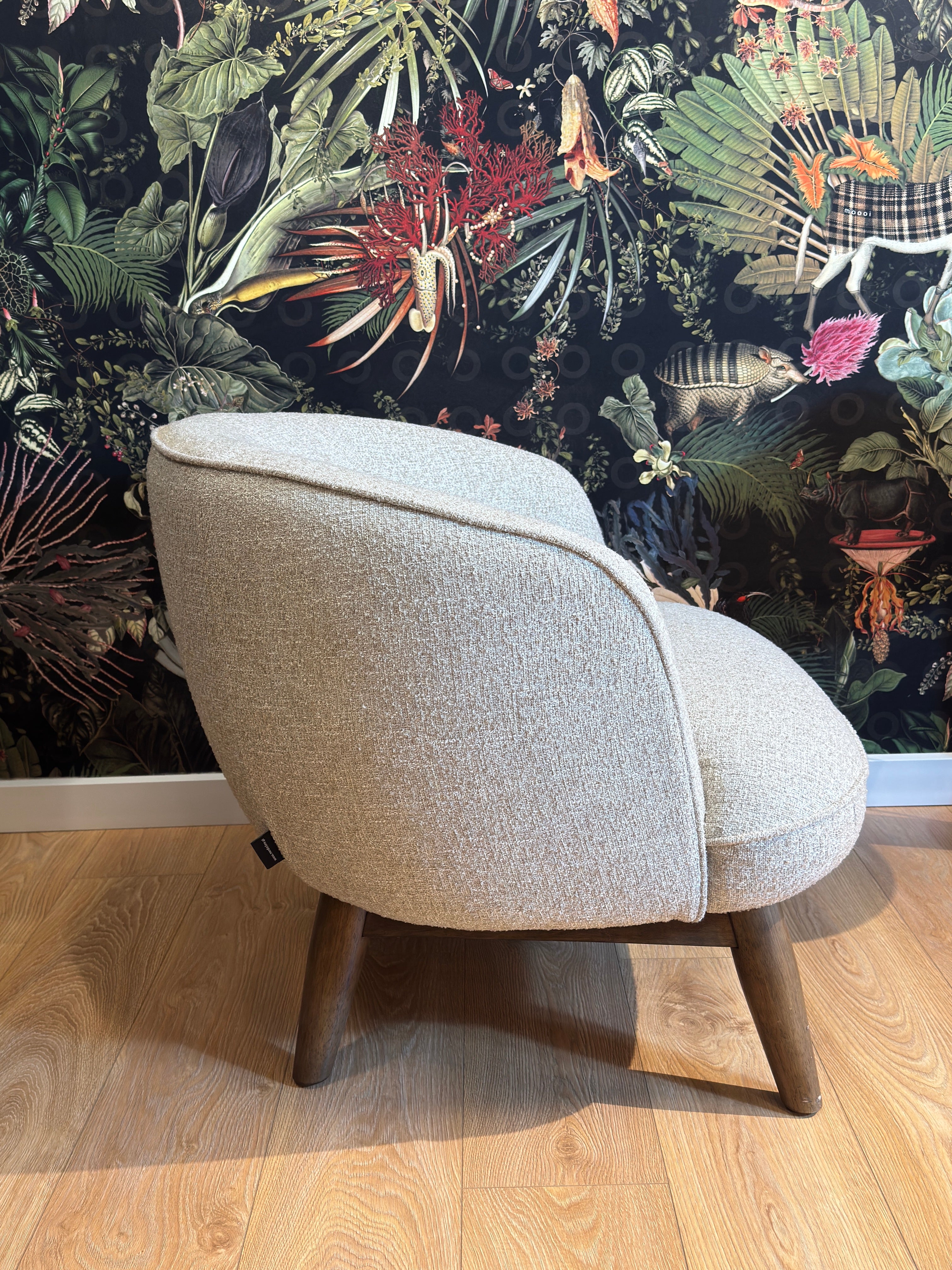 Upholstered armchair BENTON in gray-beige with a wooden base - display model