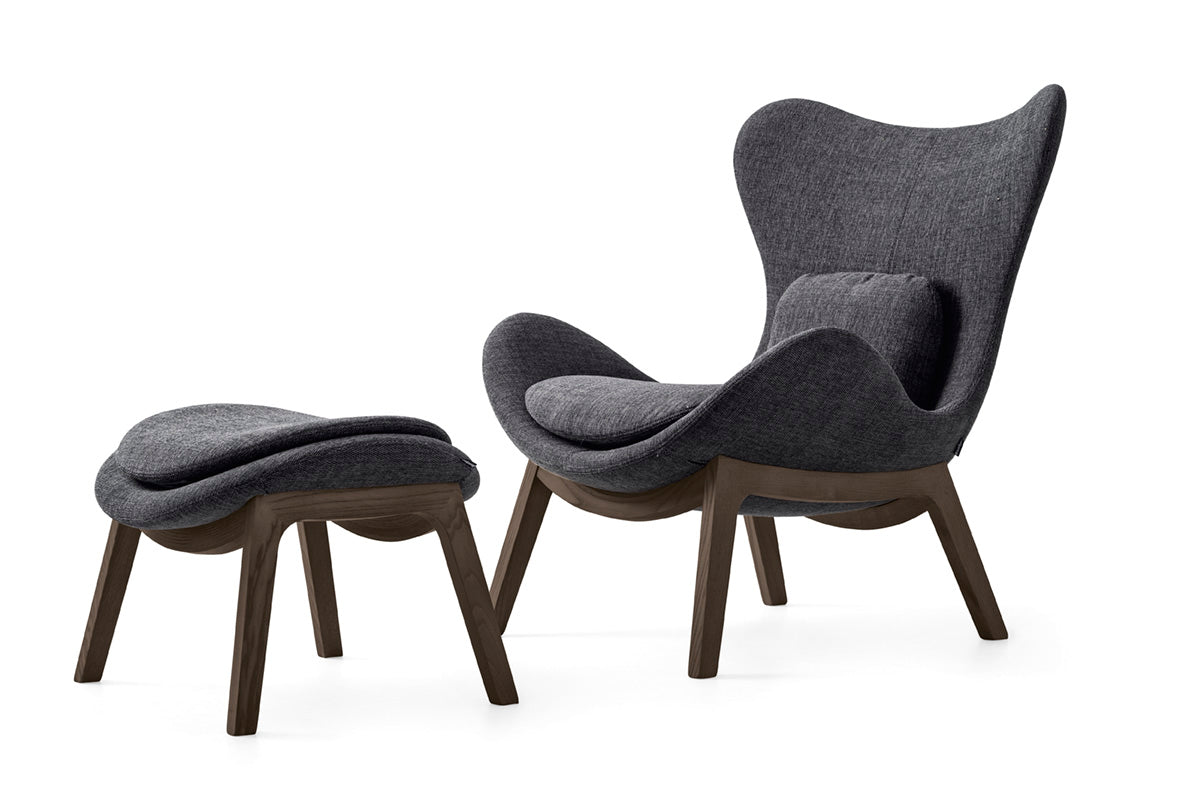 Upholstered LAZY armchair with a dark wooden base