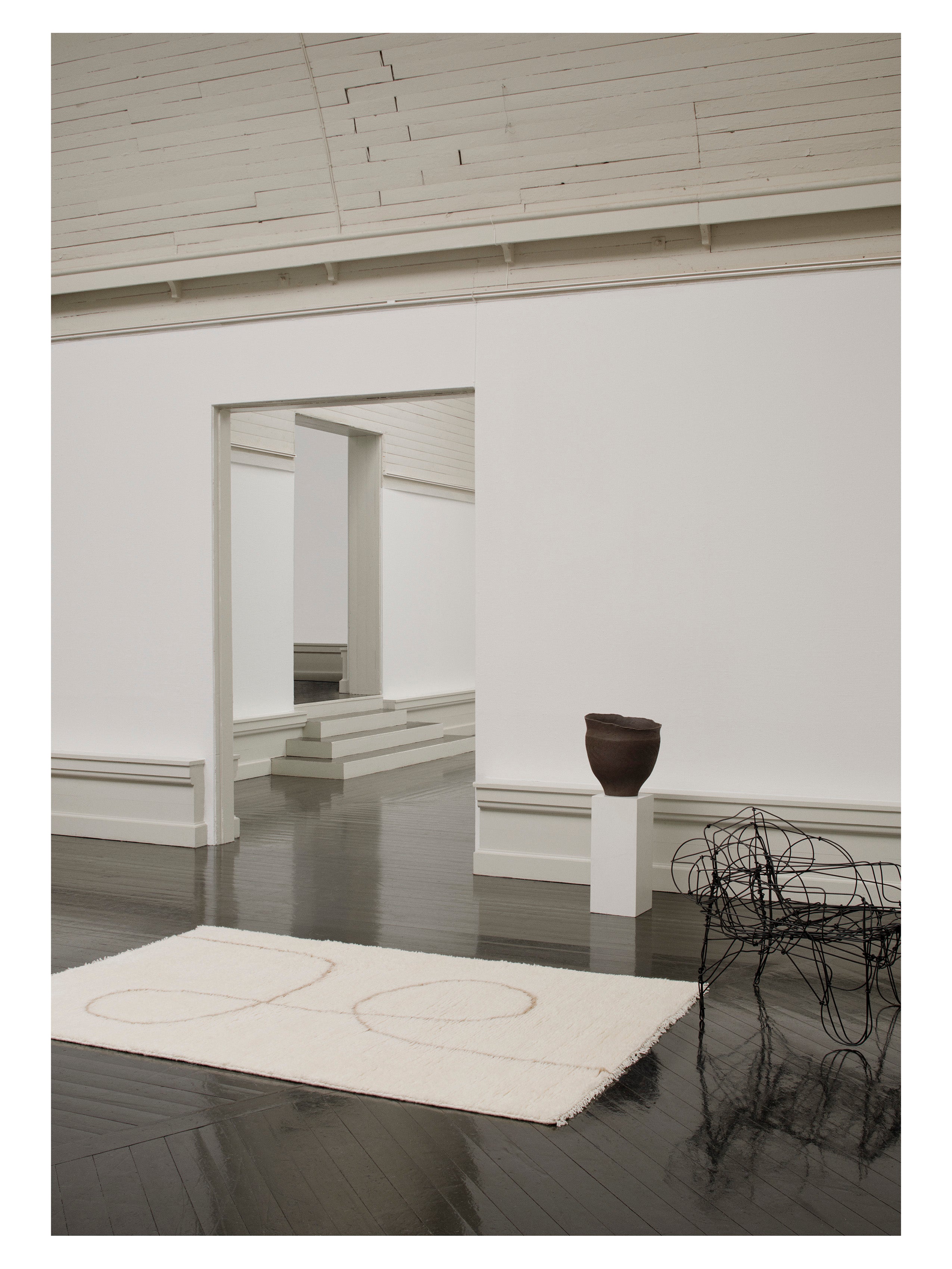 Vloerkleed ASTRAL SPIRAAL gebroken wit met karamel patroon