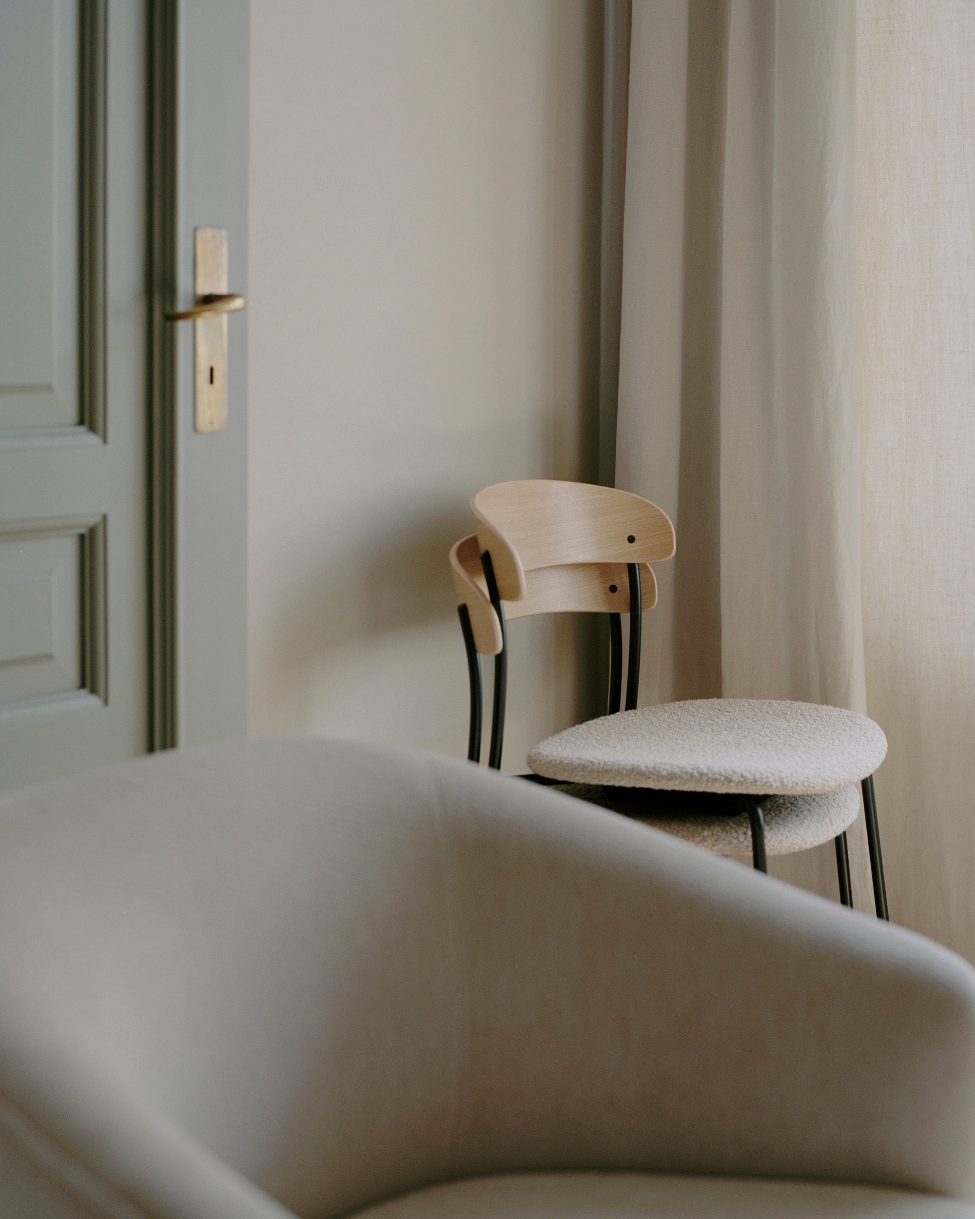 Missing chair upholstered with oak veneer