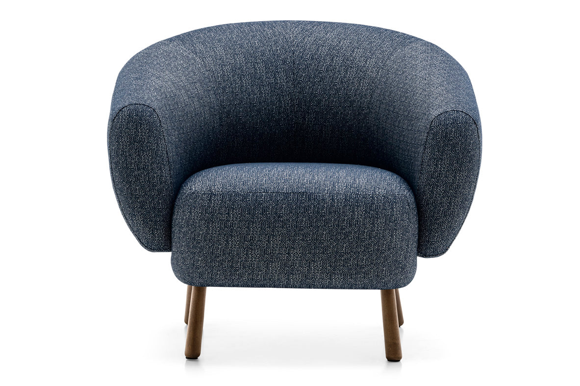 Upholstered RIO armchair with a dark wooden base