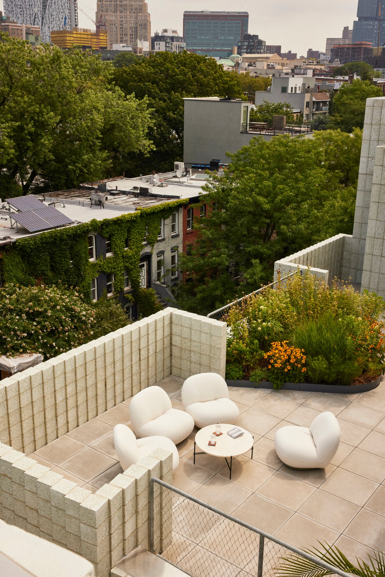 PACHA upholstered outdoor armchair with a gold base