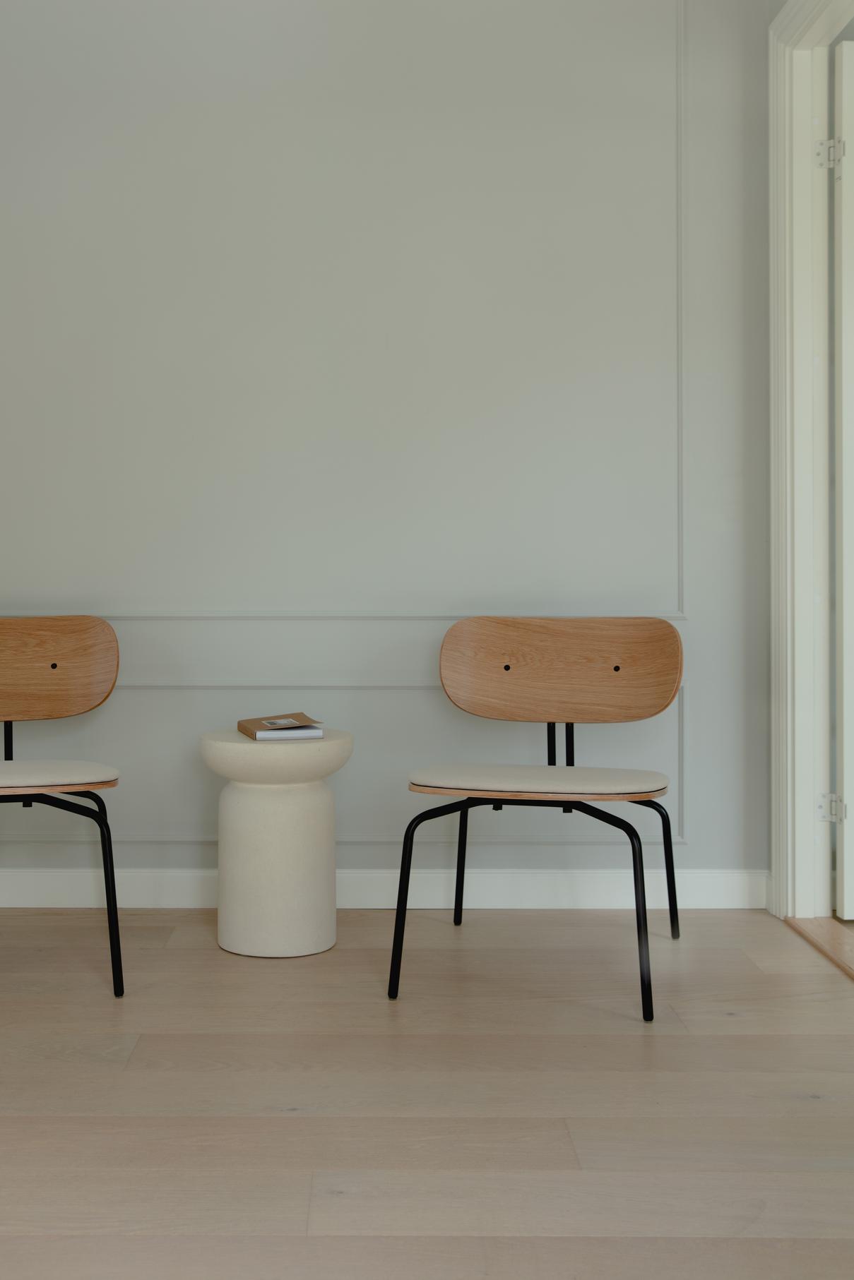 Curious Baby Blue armchair with a black base