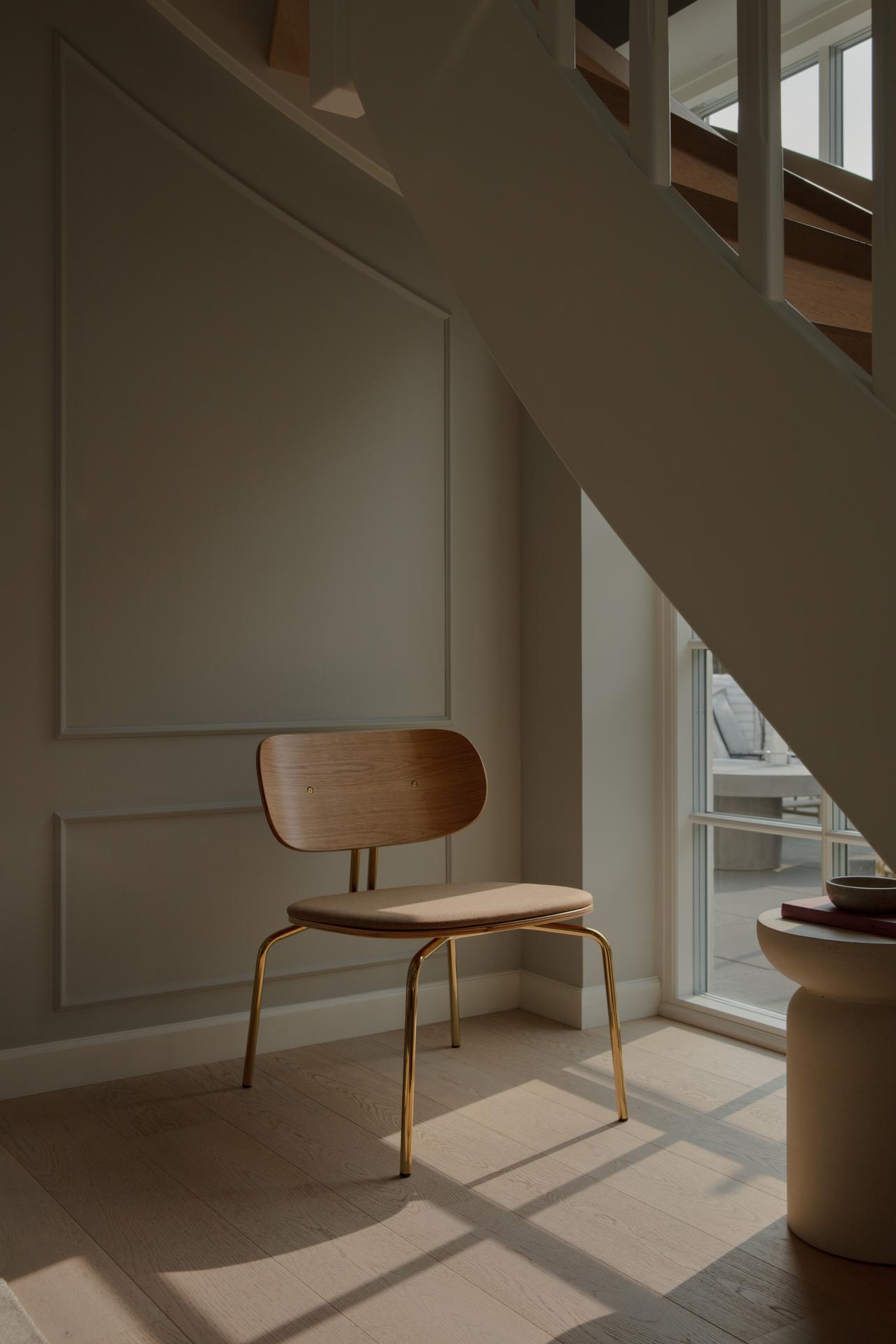 Curious Baby Blue armchair with a black base