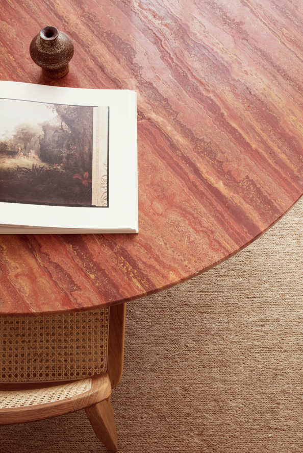 EPIC round table red travertine