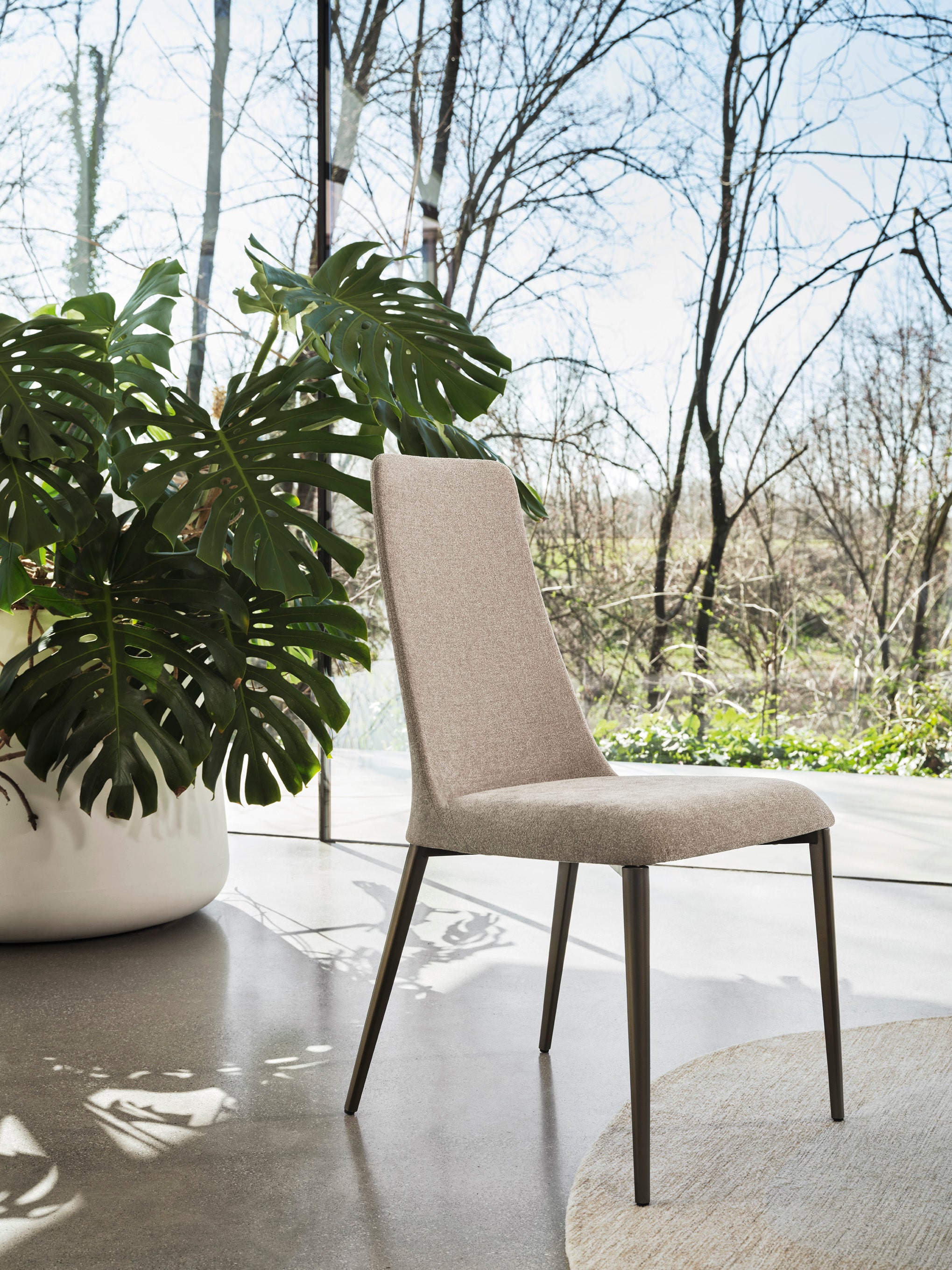 ETOILE upholstered chair with a brown metal base