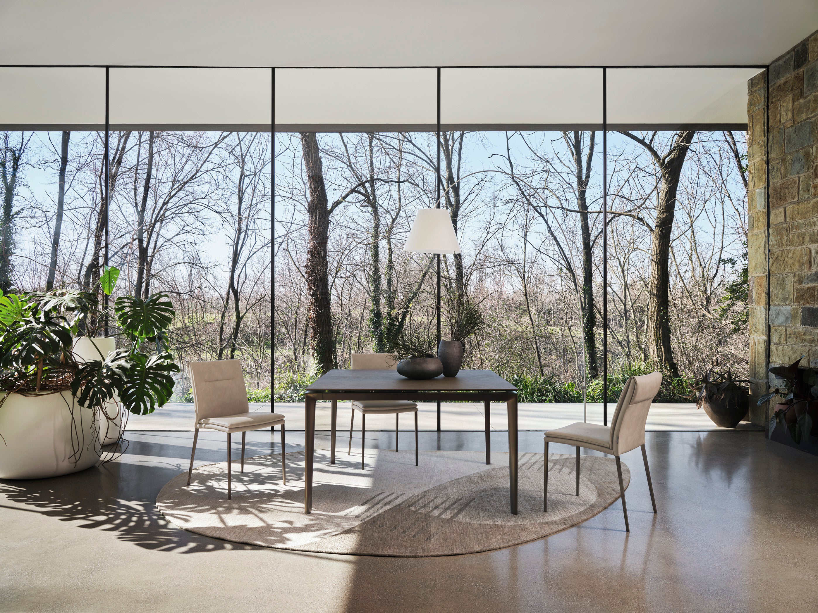 CARMEN LARGE upholstered chair with a brown base