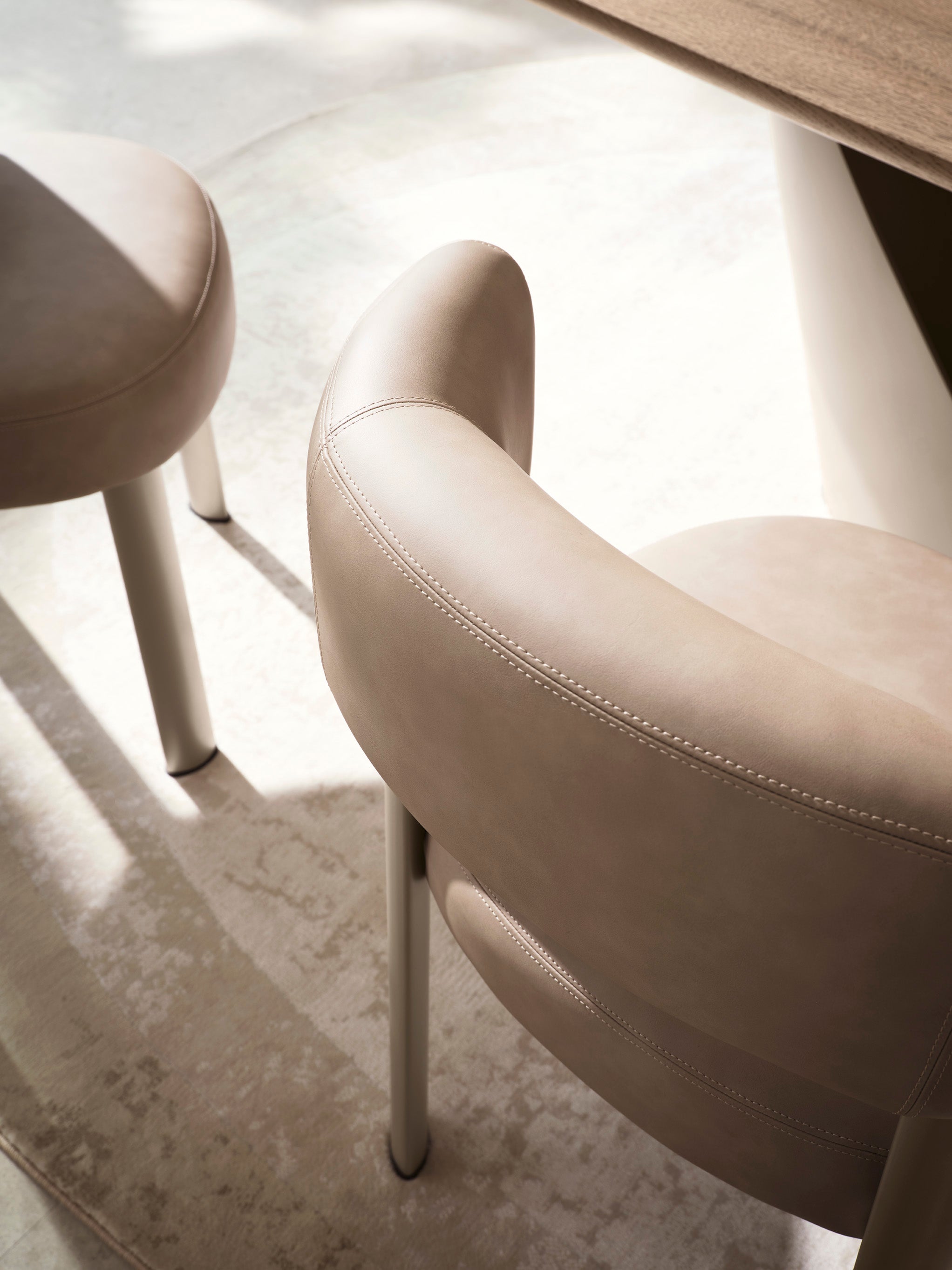 Upholstered GLEN chair with a brown base