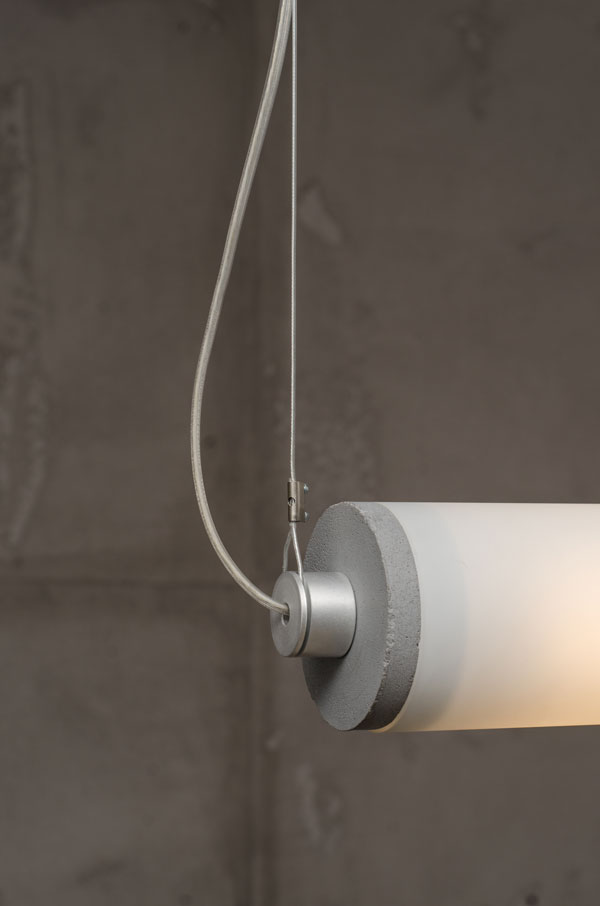 LONGA horizontal pendant lamp with a milky shade and concrete detail