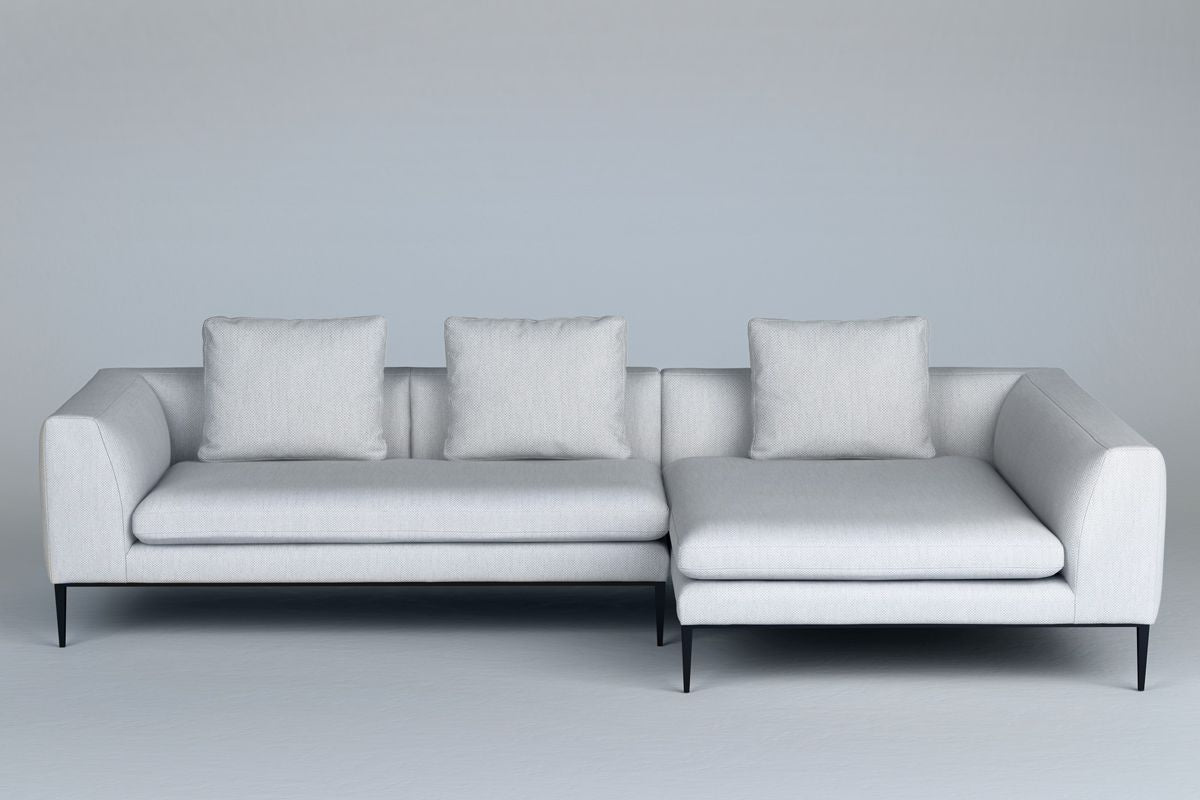 Left-facing 3-seater NASH upholstered corner sofa with black base