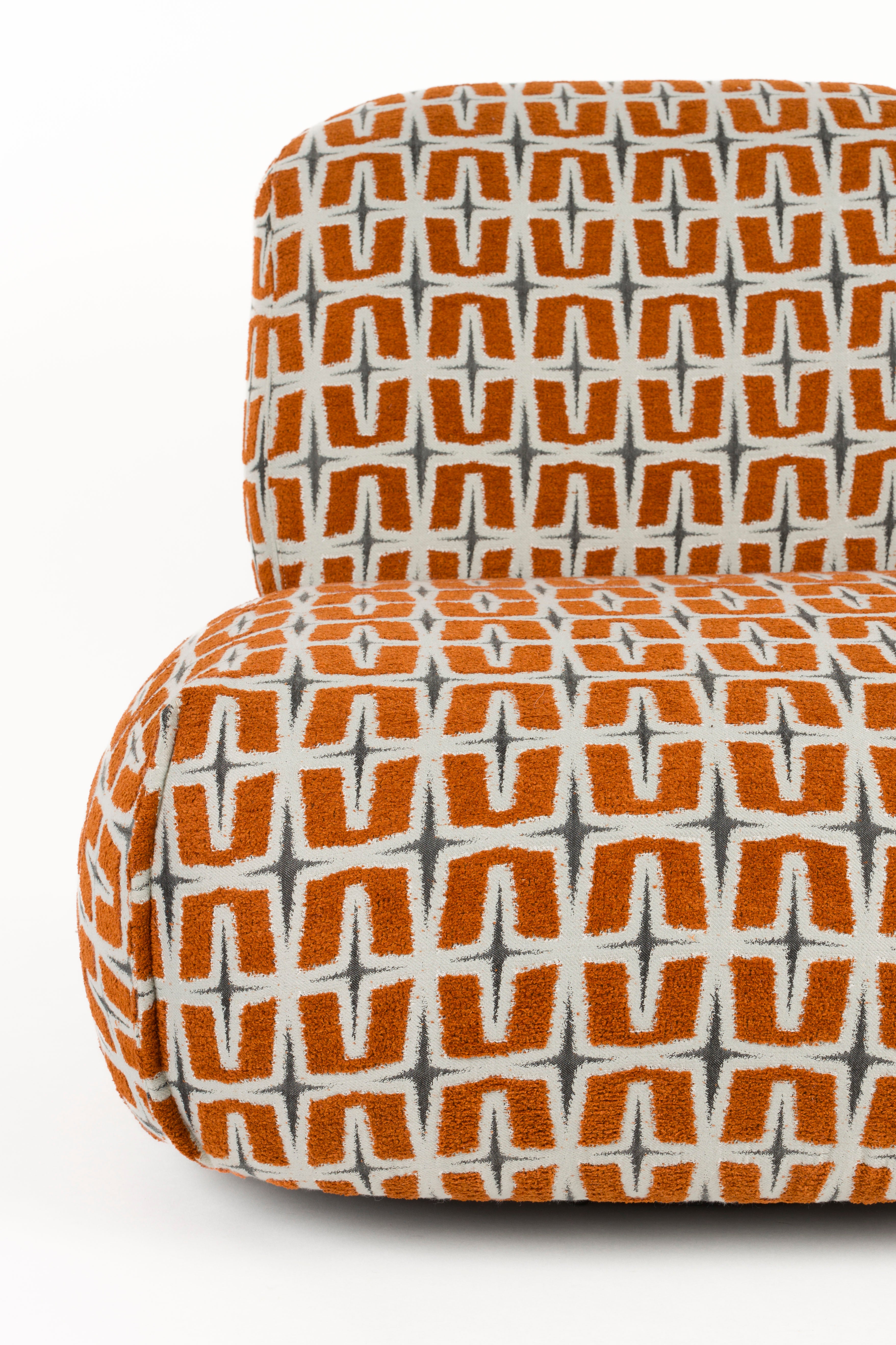 RITZ armchair in orange with geometric pattern