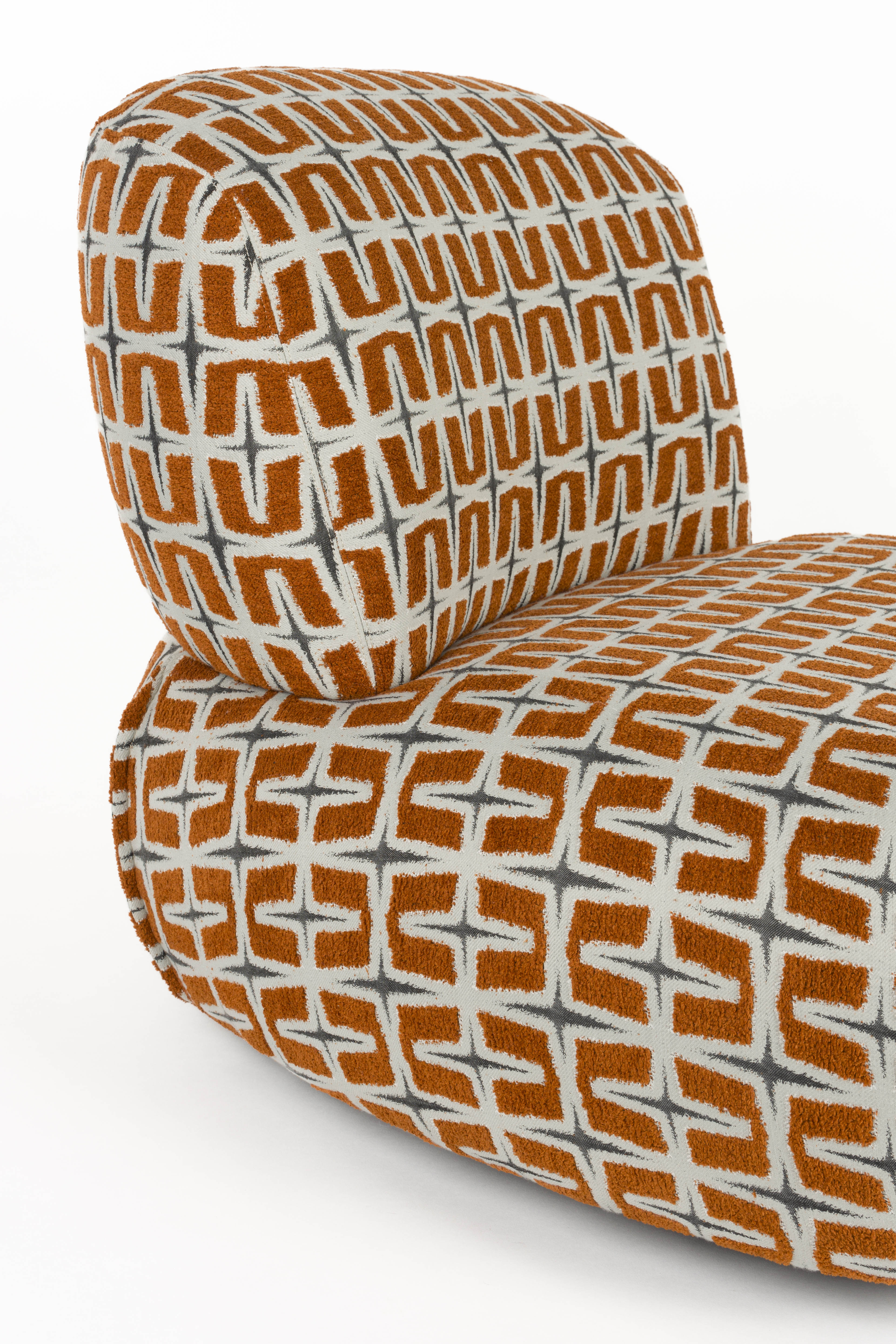 RITZ armchair in orange with geometric pattern