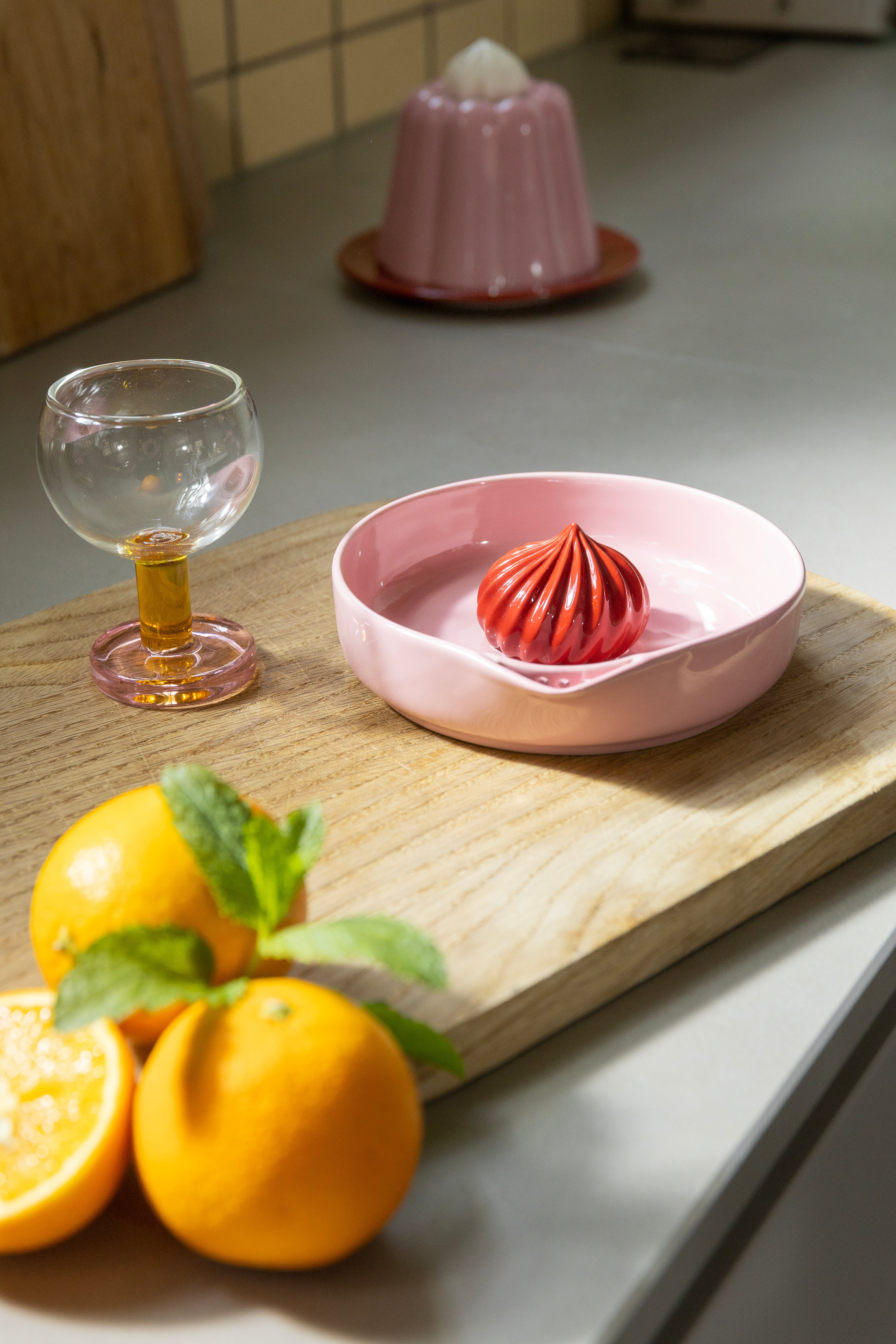 PUDDING pink citrus juicer with red