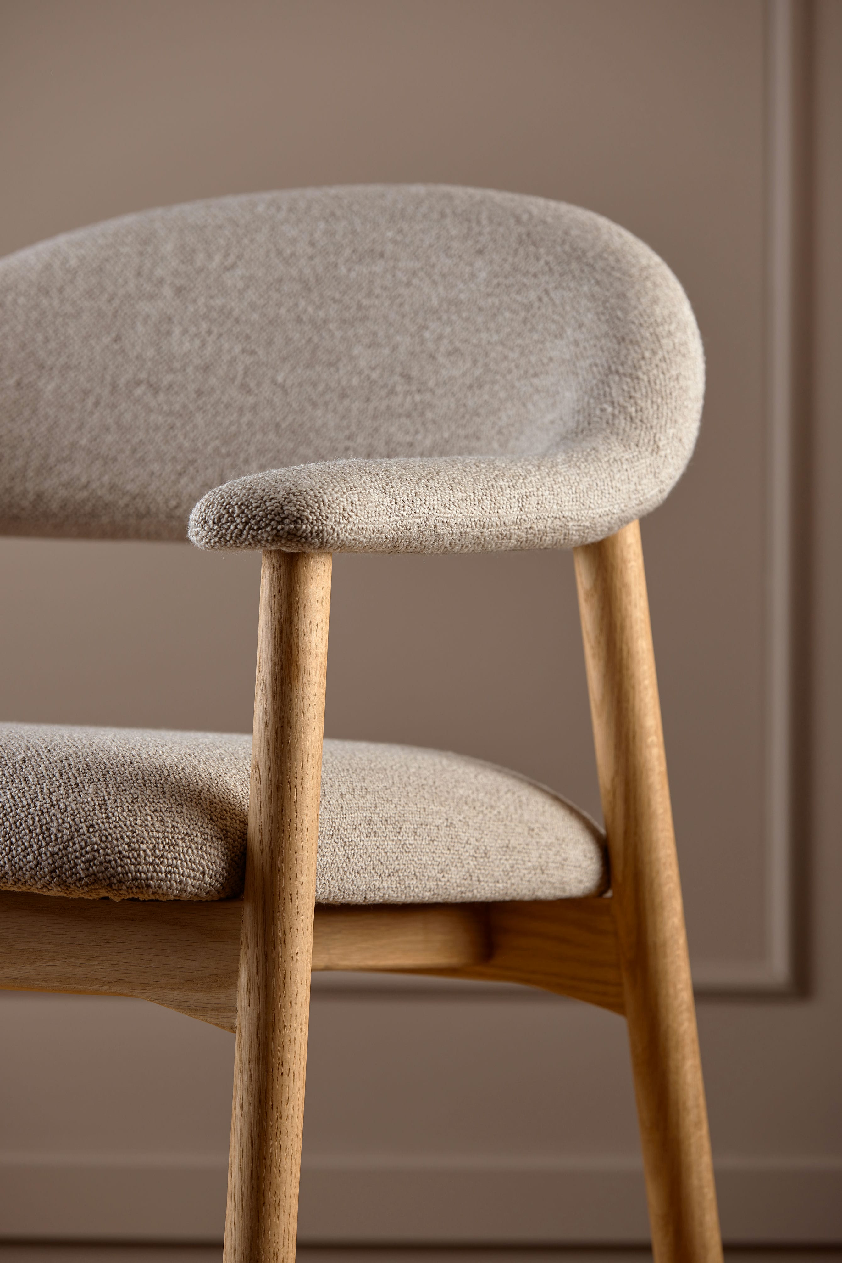 Addi beige armchair with an oak base