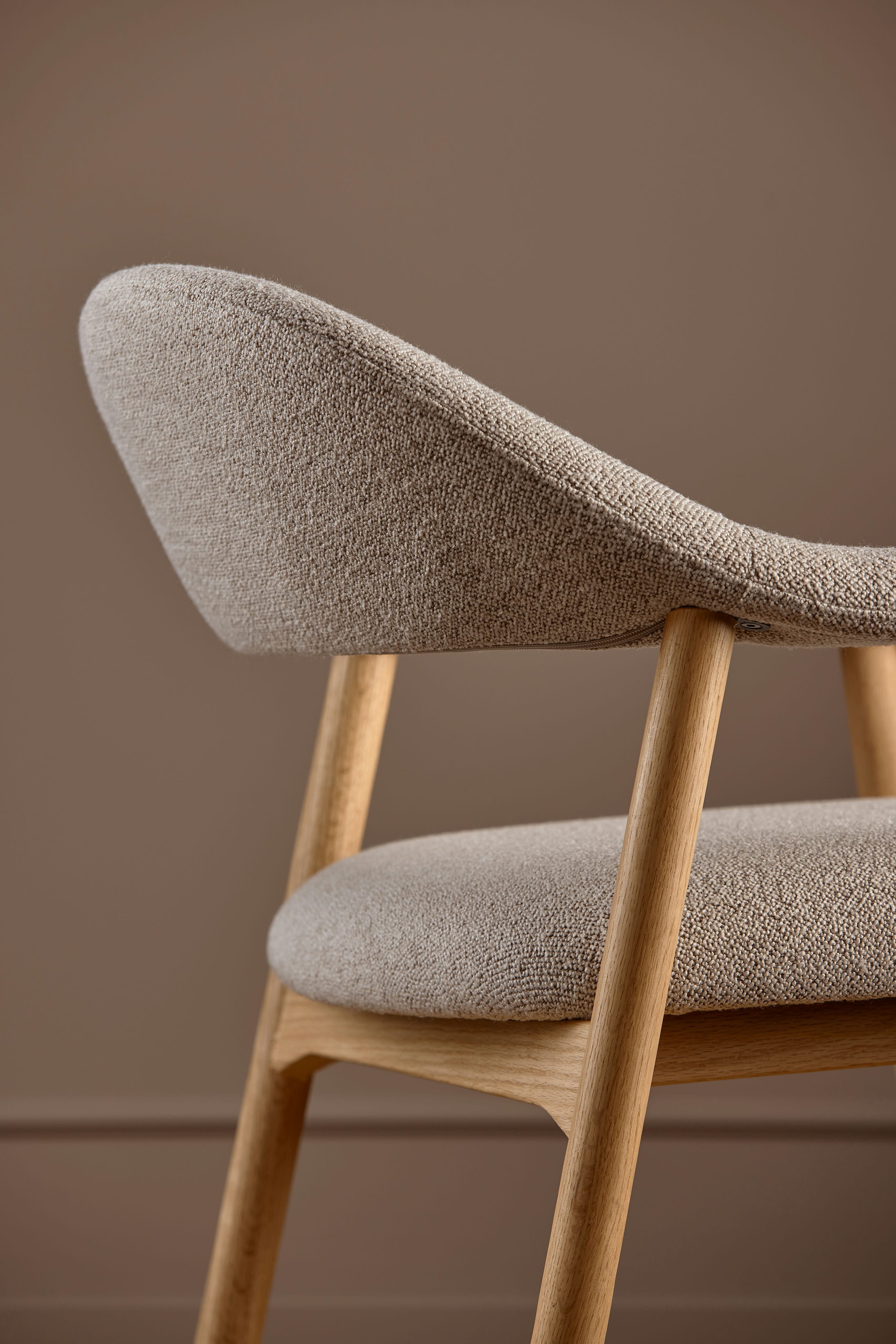 Addi beige armchair with an oak base