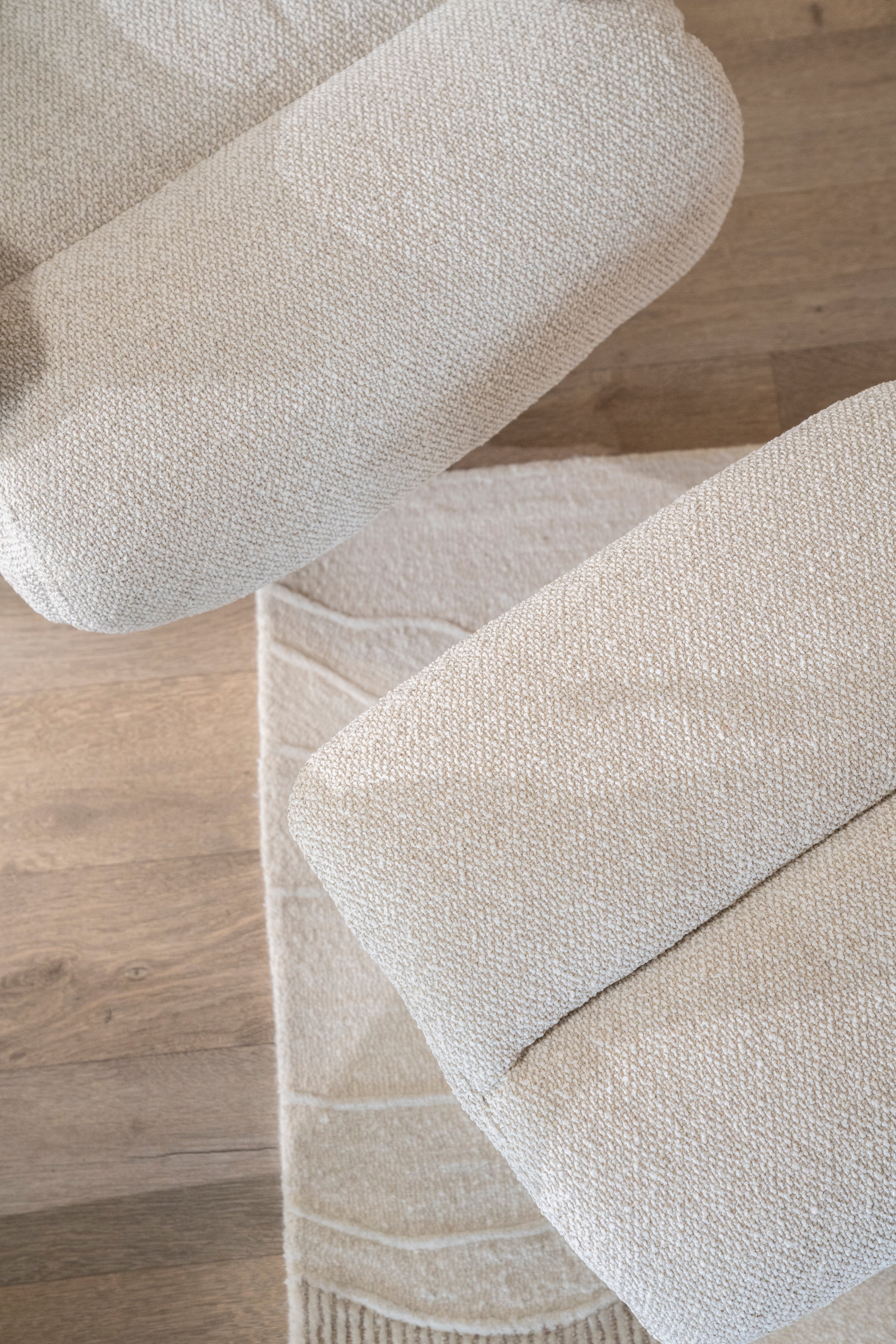 CALEB beige armchair with black base and footrest