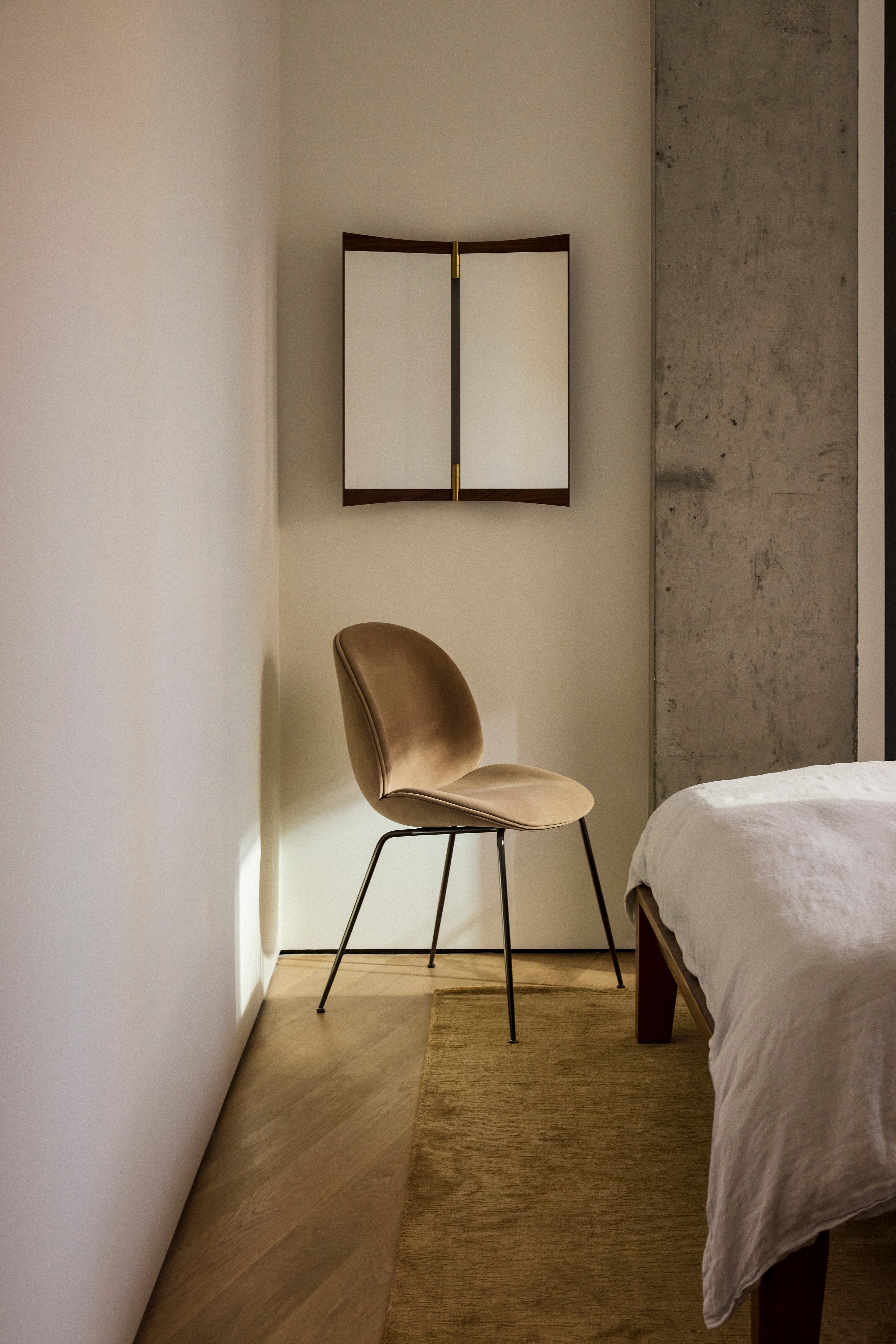 BEETLE upholstered chair with a black base