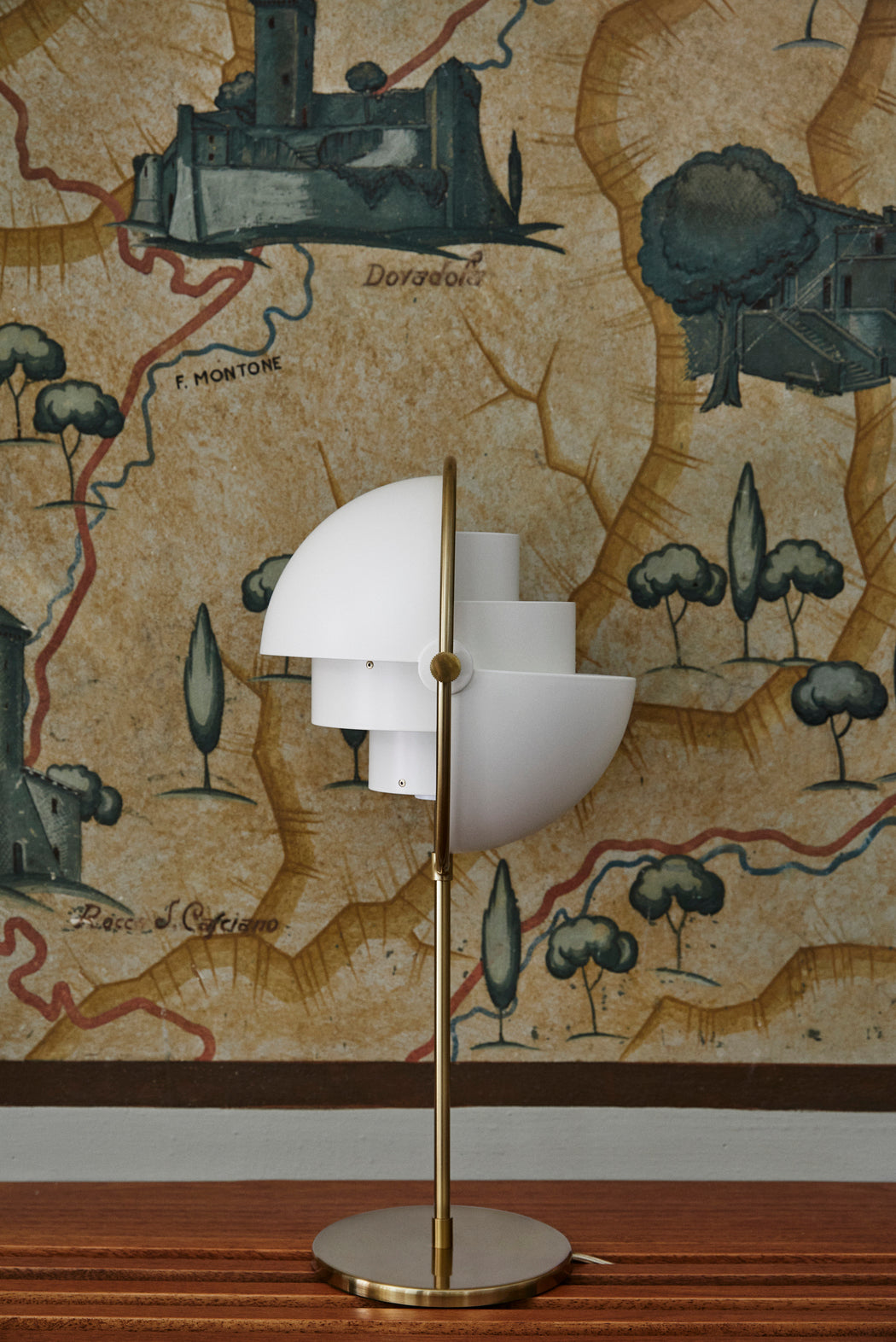 MULTI-LITE table lamp with a chrome base and white shade