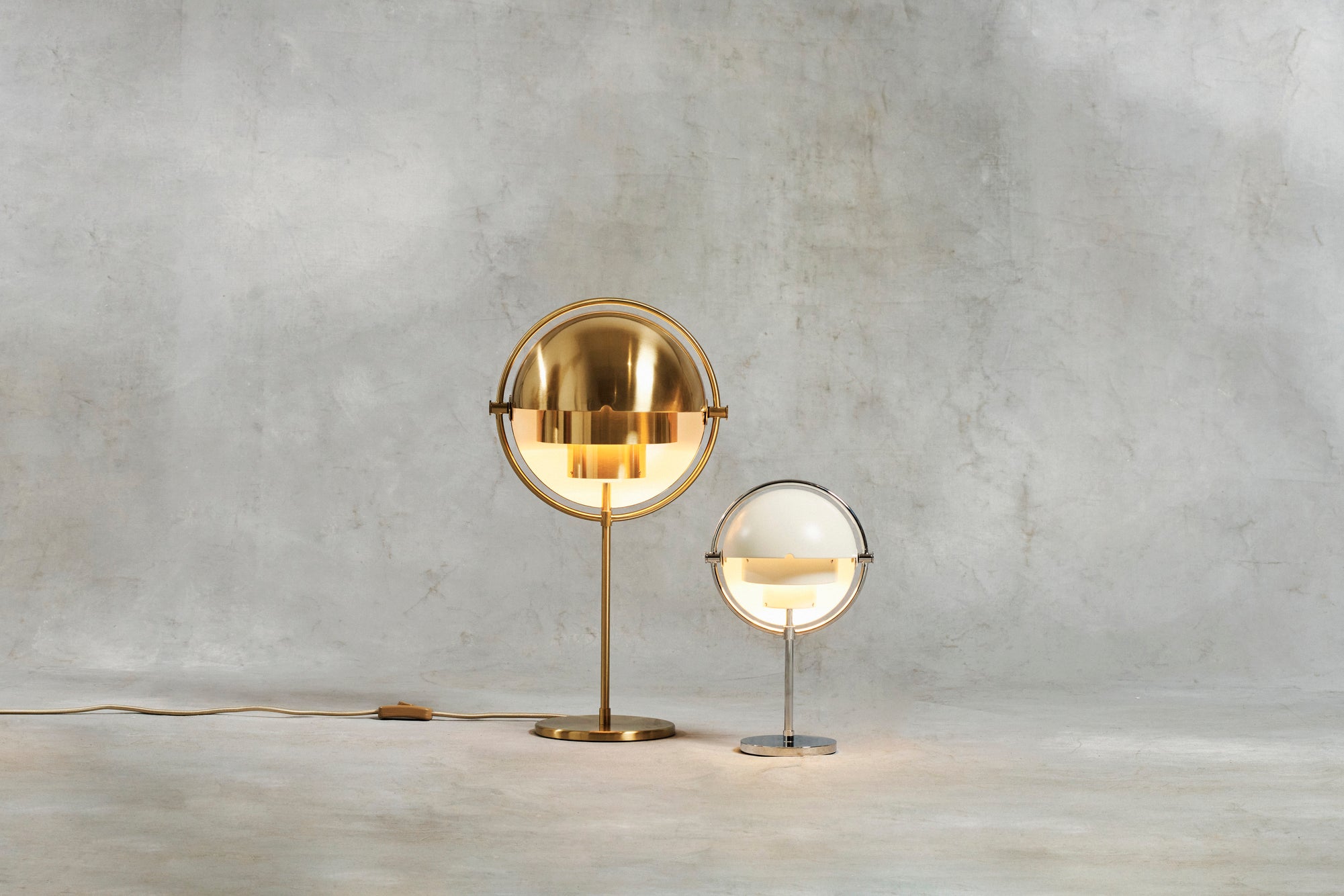 MULTI-LITE table lamp with a chrome base and white shade