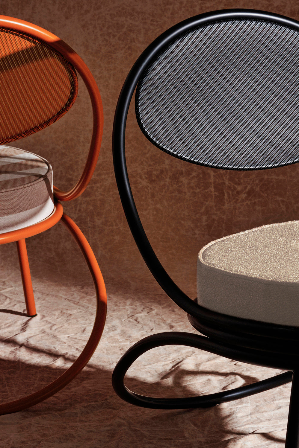 COPACABANA armchair upholstered with an orange base