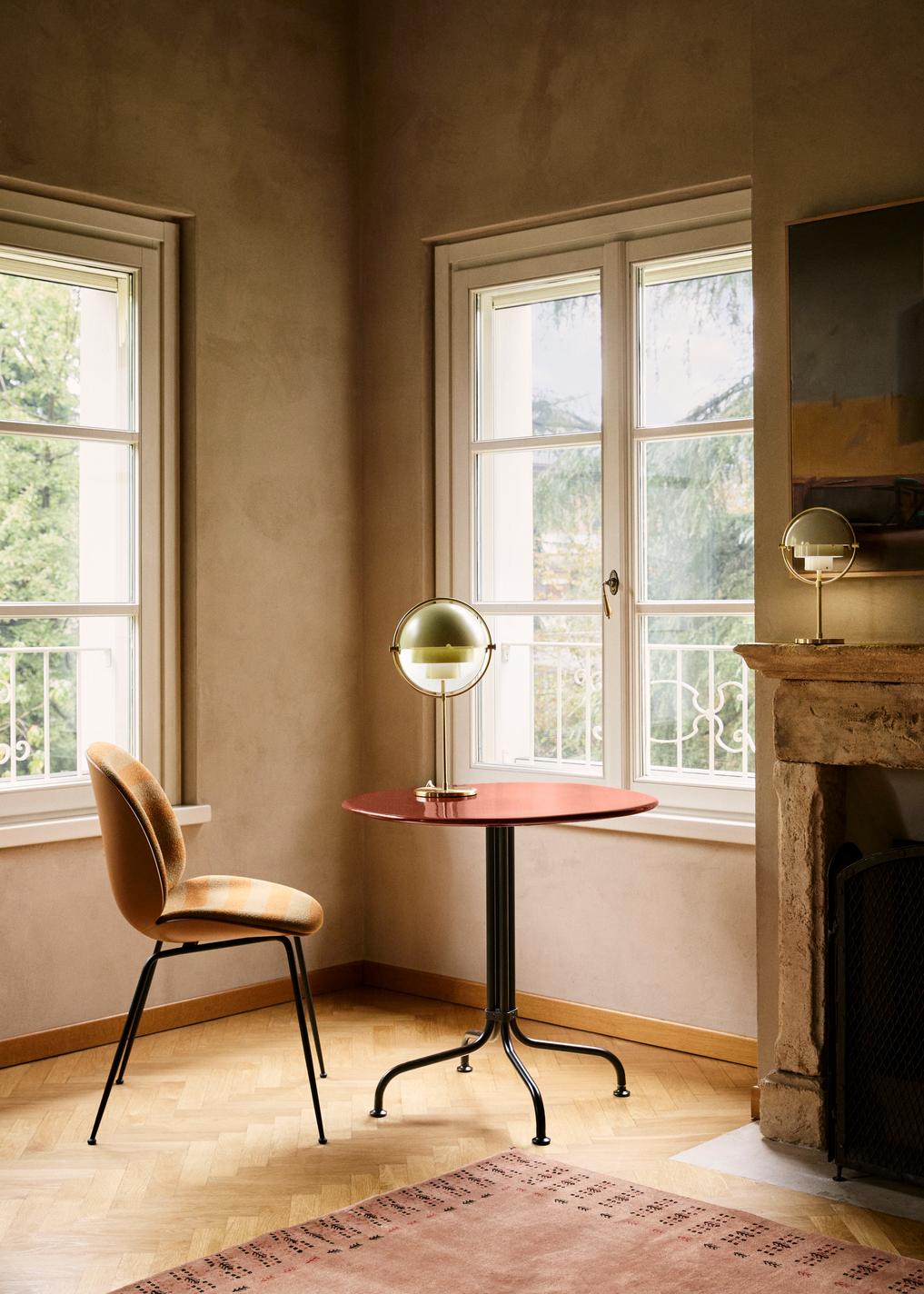 BEETLE upholstered chair with a black base