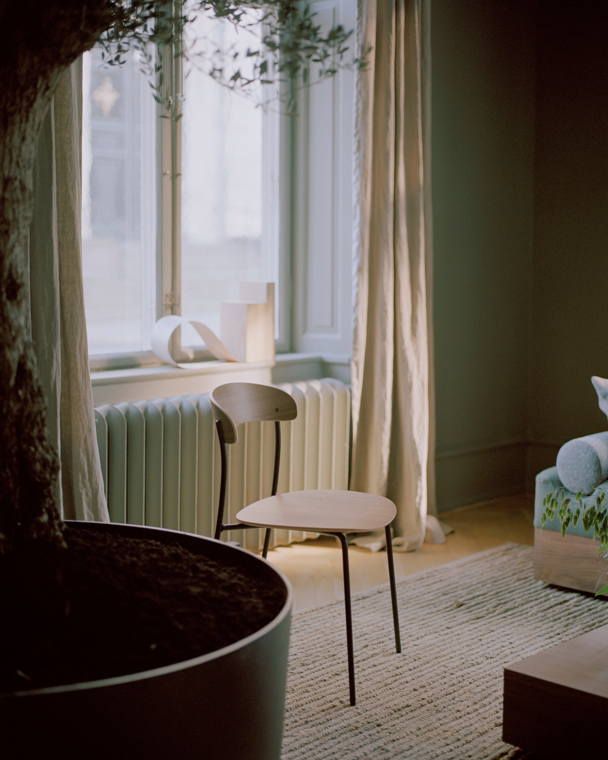 Missing chair upholstered with oak veneer