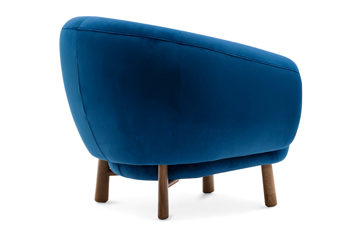 Upholstered RIO armchair with a dark wooden base