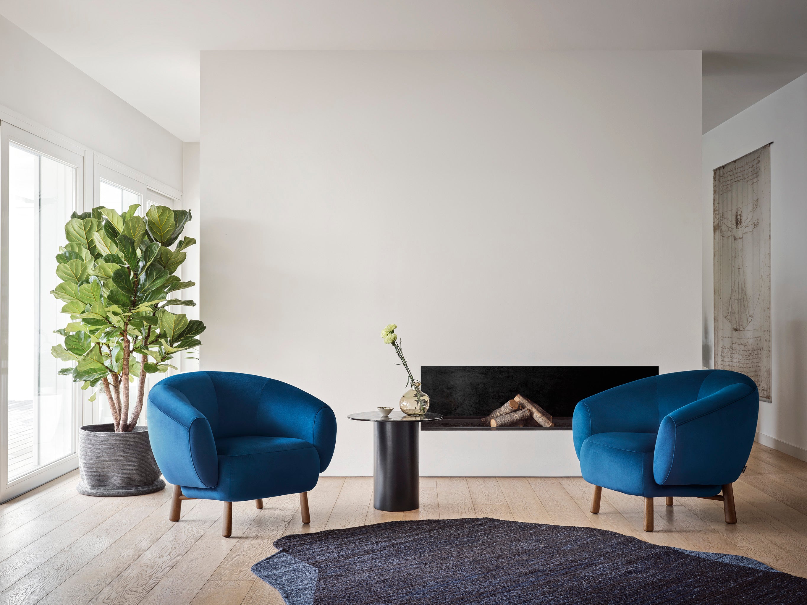 Upholstered RIO armchair with a dark wooden base