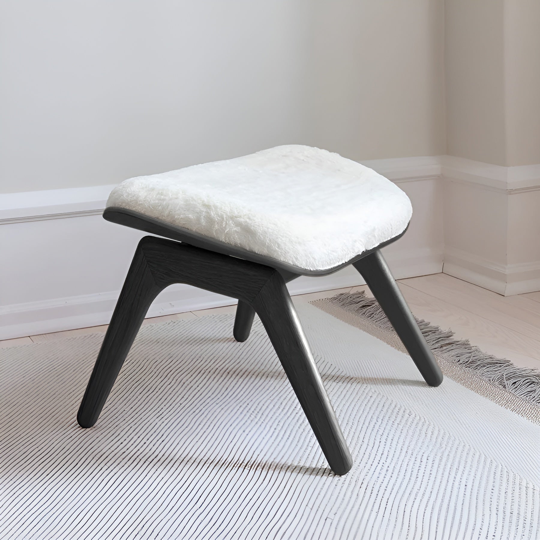READER white plush footrest with black base